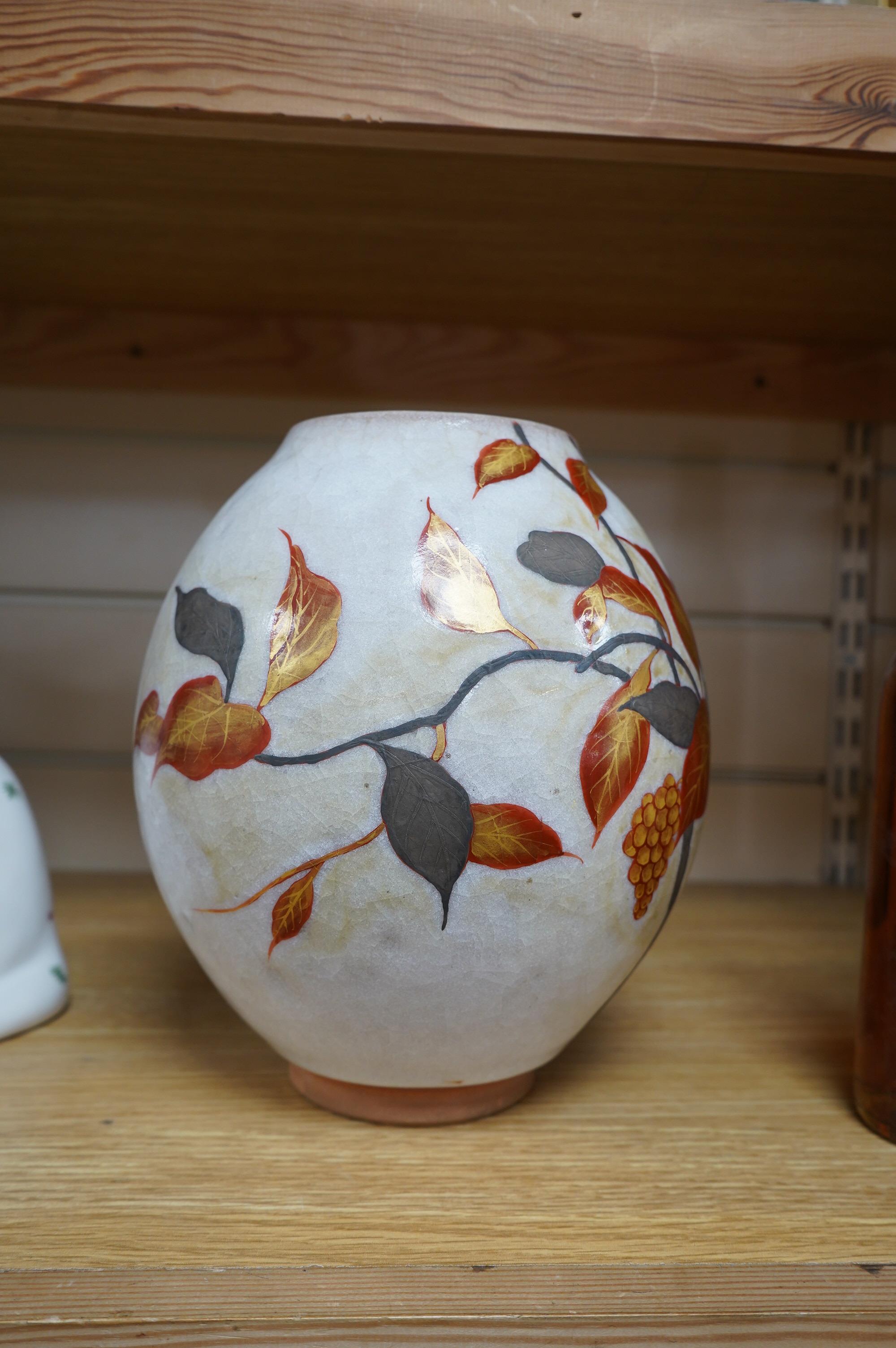 A Chinese terracotta and enamel vase with gilded leaf decoration, seal mark to the base, 23cm high. Condition - good